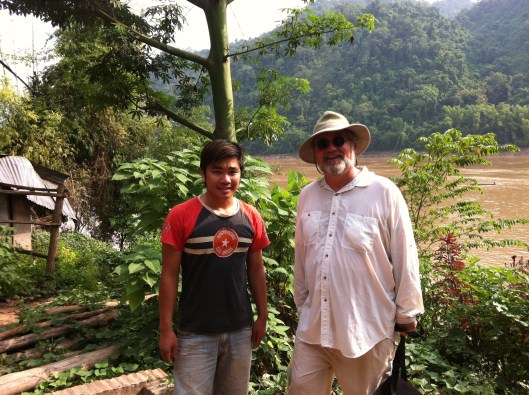 Boatman Souk and me on the banks of the Mekong.