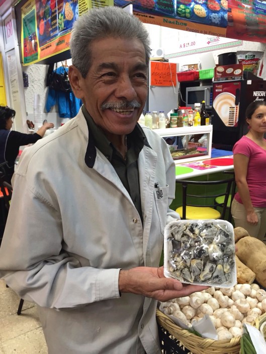 A proud vendor with huitlacoche in Mercado Coyoacan.