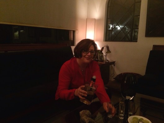 Gabriela pouring shot of tequila to wrap up a great week of ideas.