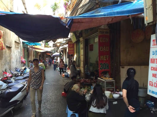 An Old Quarter market alley beckons early in the morning.