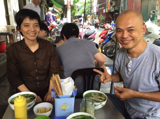 KKImnogc Tran and Vu Nhat Tan enjoy pho bo.