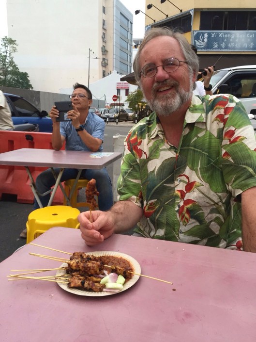 Enjoying satays from a 30 year old vendor.