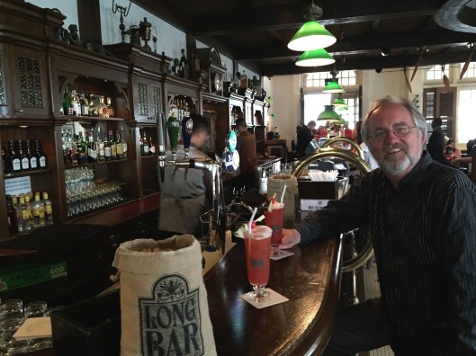 Enjoying my Singapore Sling at the Long Bar.