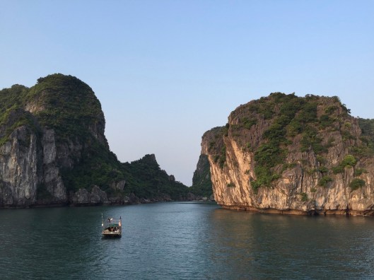 A small boat heads into an inner passage.
