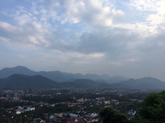 To left of the top of the mountain.