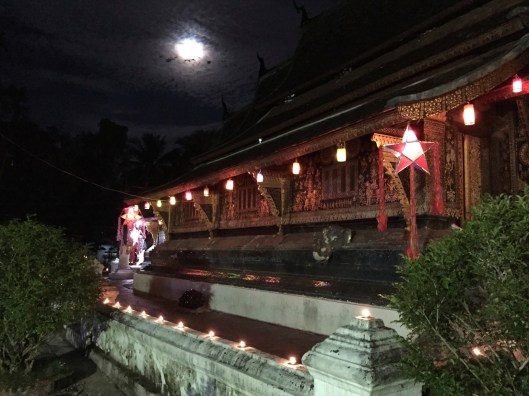 The clouds shroud a full moon.