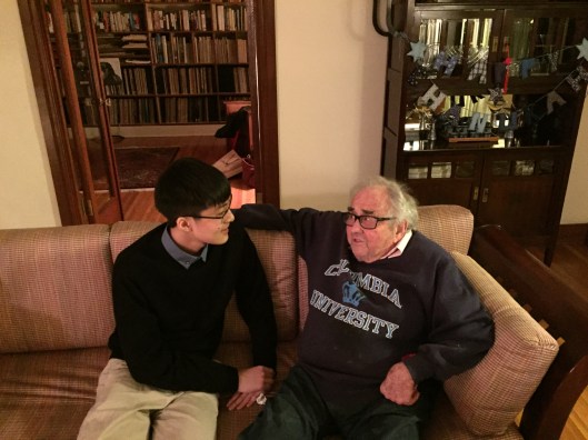 19 year old Nguyễn Minh Nhật listening to 93 year old William Kraft tell him about Igor Stravinsky.